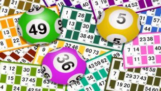 A pile of lottery cards and balls
