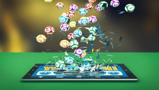 A tablet with lottery balls falling out of it